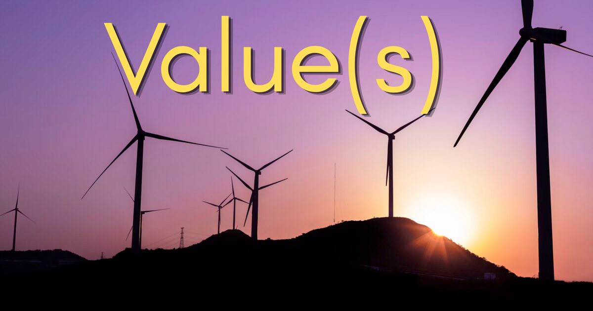 Value(s) — wind turbines silhouetted against a purple and orange sunset